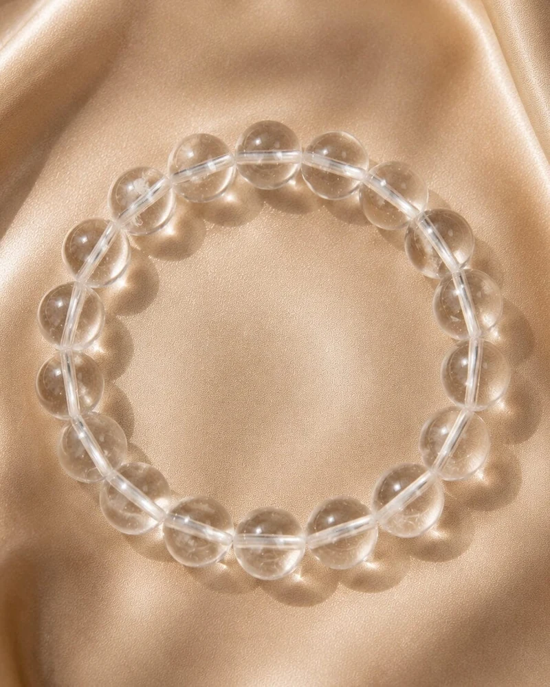 Clear quartz bead bracelet on champagne silk