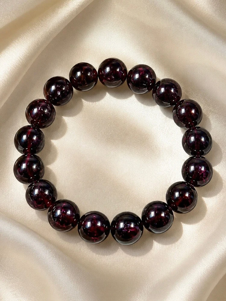 Deep red garnet bead bracelet on champagne silk