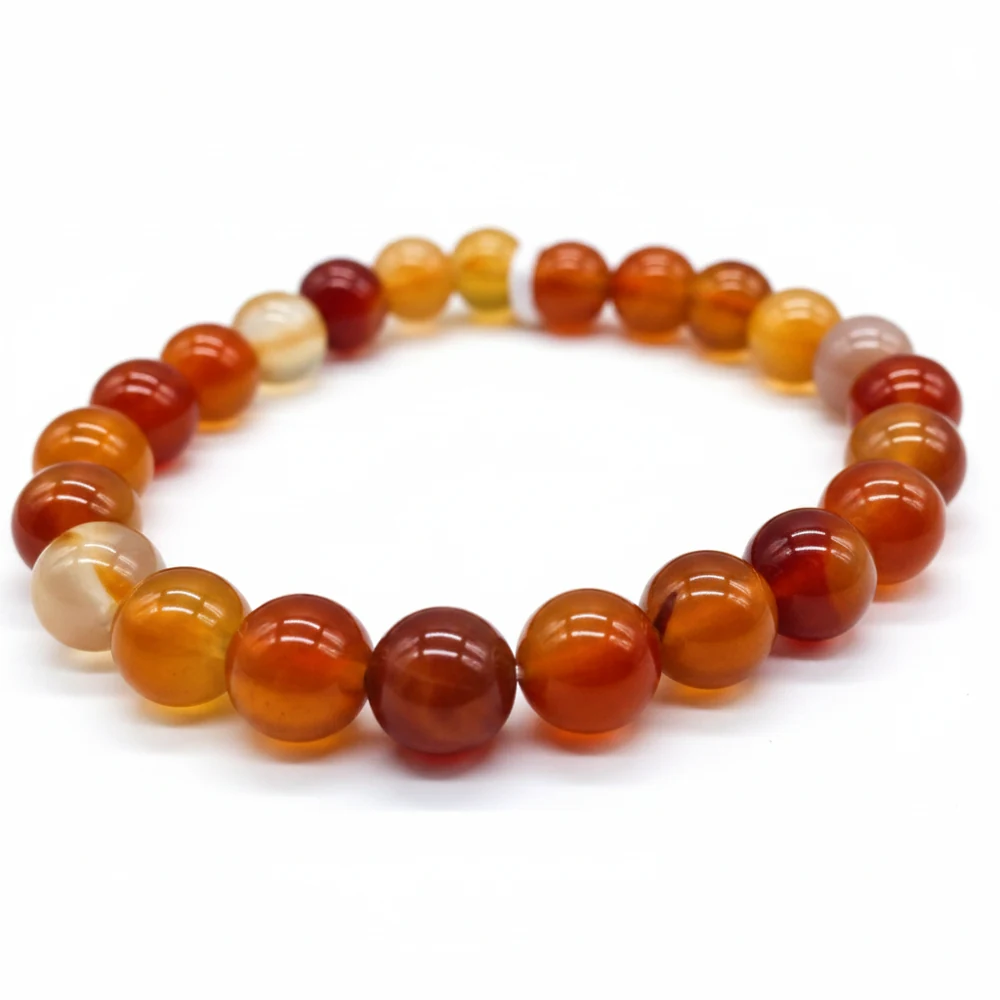 Red and amber agate bead bracelet against a white background