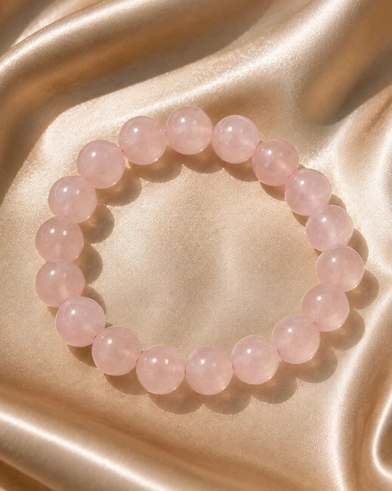 Rose quartz bead bracelet on champagne silk